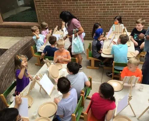 students learning math concepts using Montessori decimal system materials