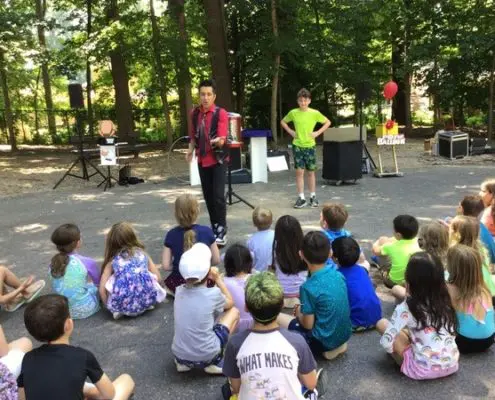 students learning to tell time with Montessori clock materials